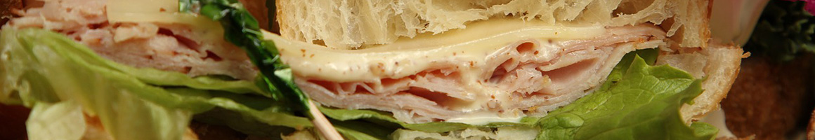 Eating Sandwich Bakery at Suzanne's Bakery & Eatery restaurant in Athens, AL.